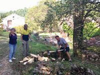 She generously offers to share firewood that they cut and split