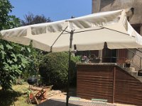 July 31 - after putting it off for months, a parasol is delivered to La Cachette. It's hot and dry en SW France!