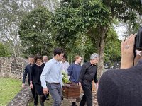 The day after is the family burial. Elizabeth and James carry the coffin