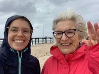 The girls want a wet walk on Henley Beach