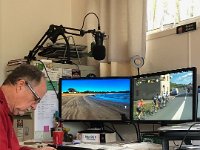 Stephen  adjusts his bike shoes whilst watching Le Tour de France Femmes