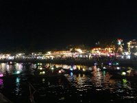 Tourist craziness sending floating wishes  off down the river