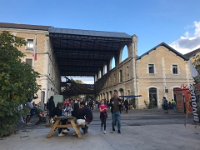 Some retail spaces, and a hall with numerous chateau selling their vineyard wares. But given all were cycling, tasting was limited