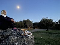 Sitting on the Dolmen, Paulie is on watch under the bright moon