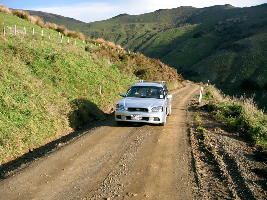 We decide to hit the dirt. It's a big drop, but our 4WD can cope